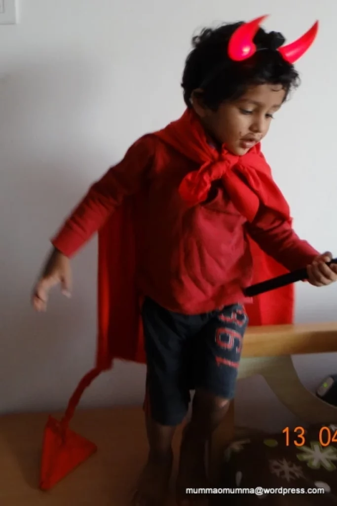 Kids DIY Devil Costume featuring a child in a devil costume